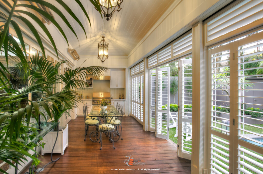 Multifold aluminum shutters at an outdoor kitchen